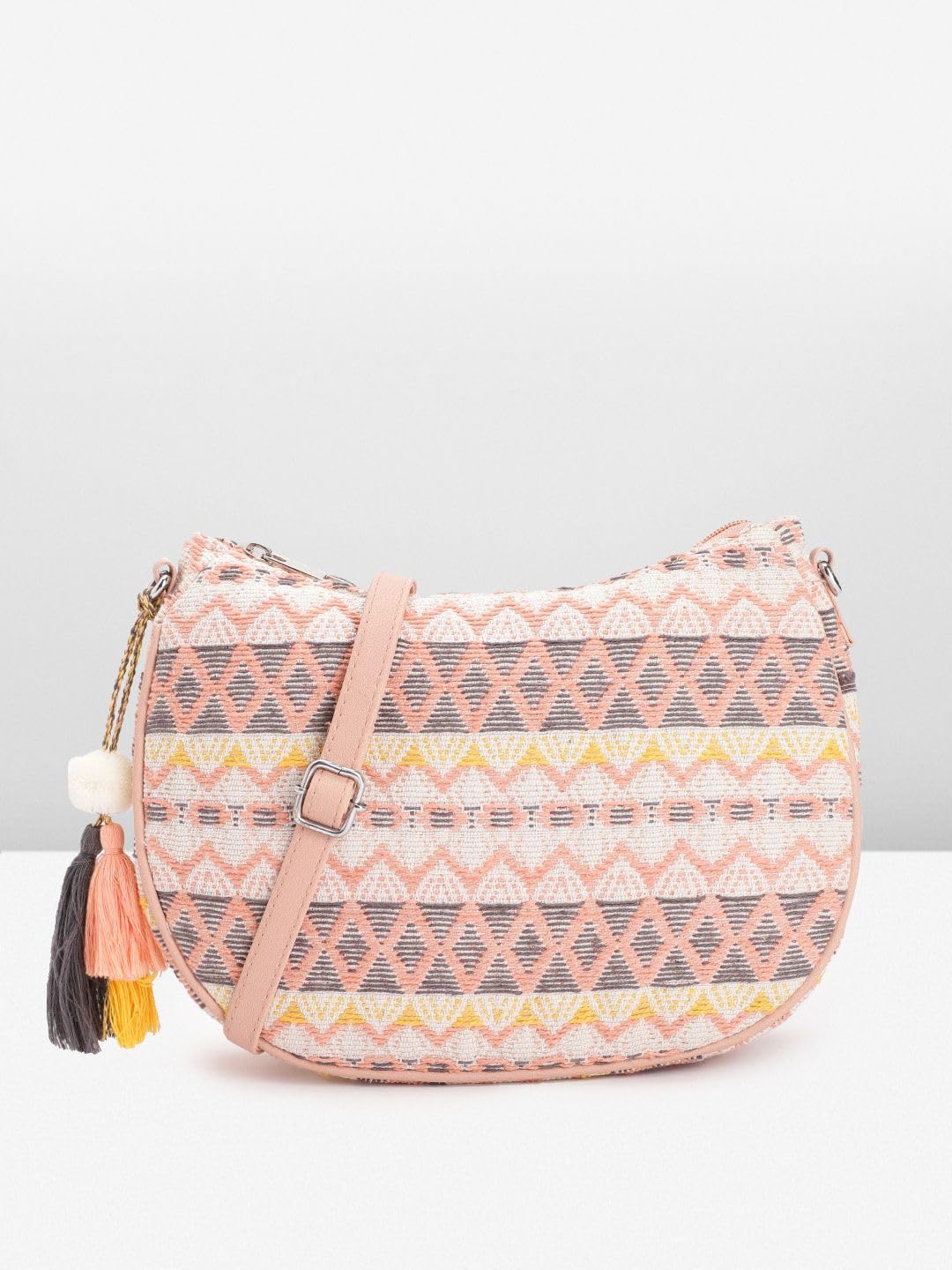 PRIMROSE Textured Self Design Half Moon Sling Bag with Tasselled Detail