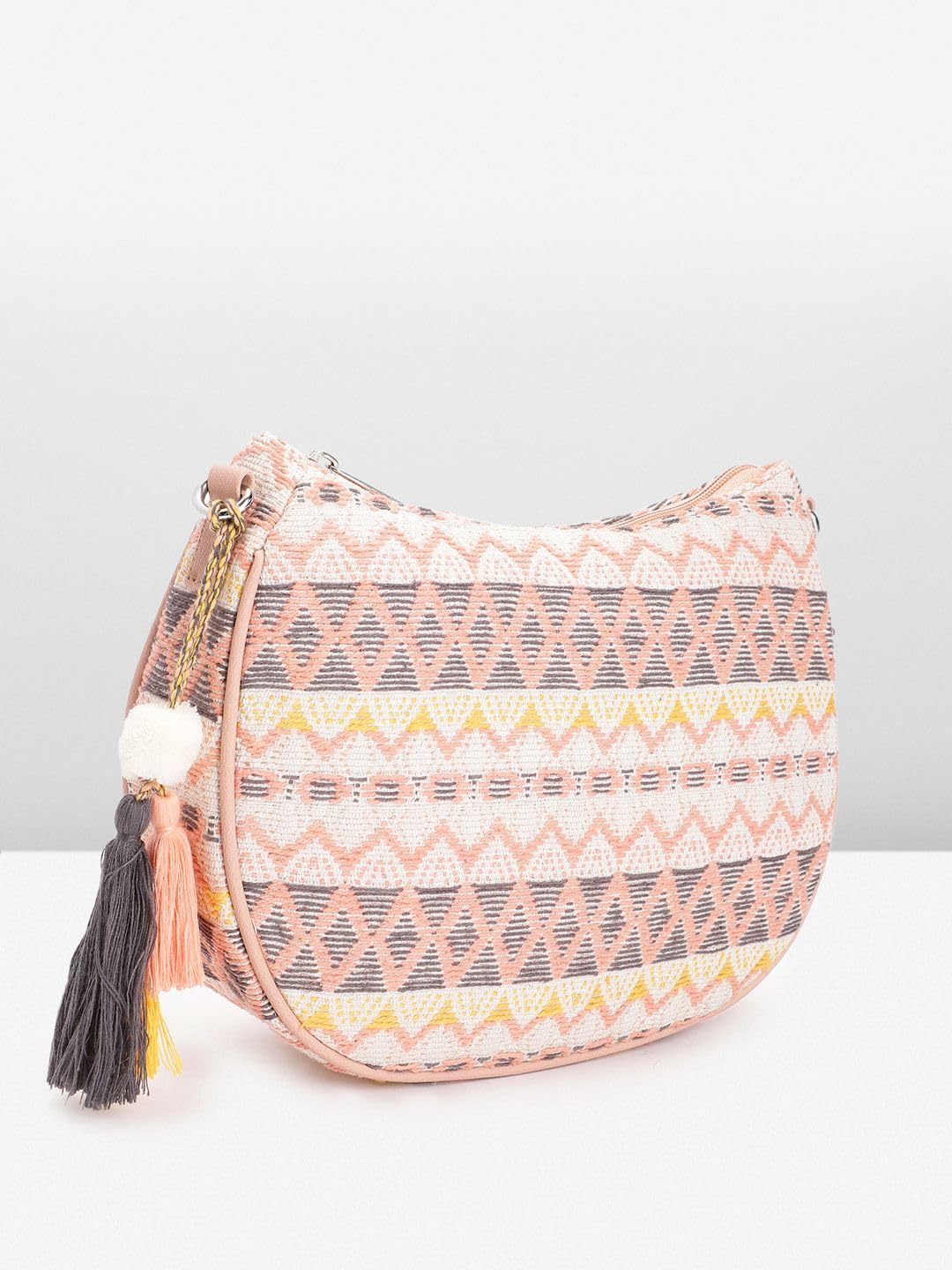 PRIMROSE Textured Self Design Half Moon Sling Bag with Tasselled Detail